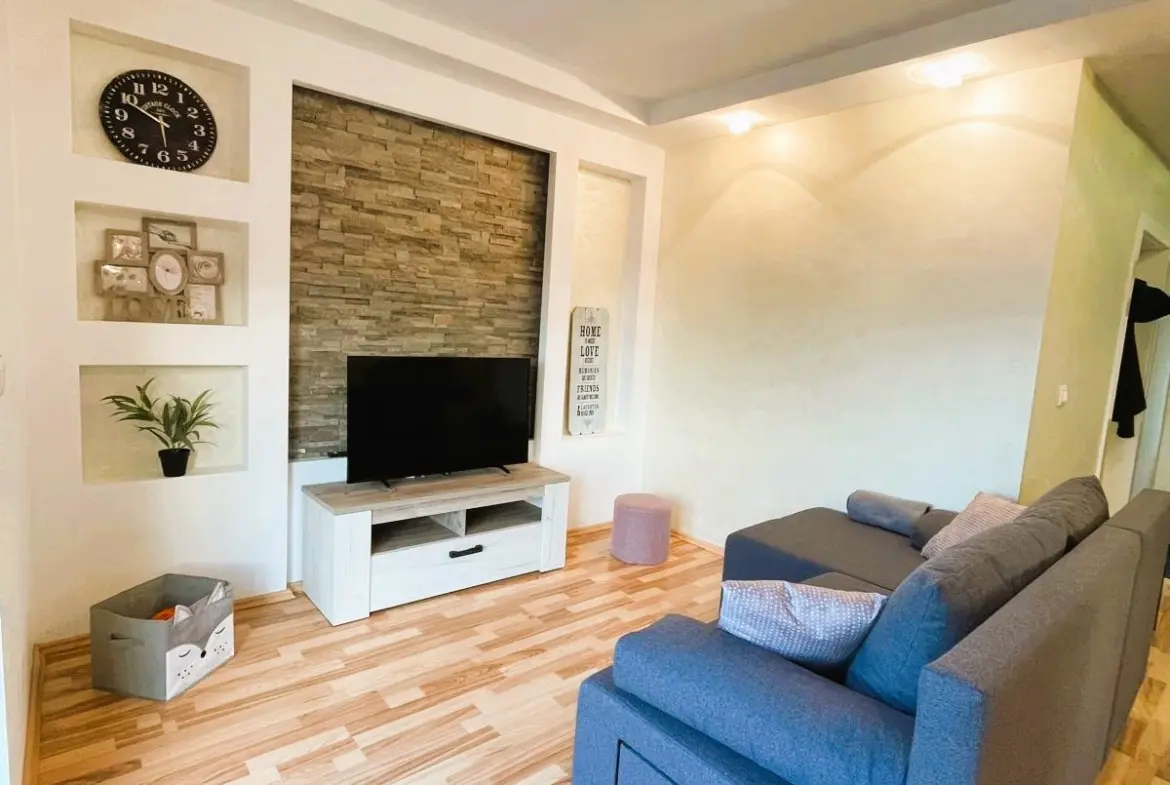 Living room with stone wall